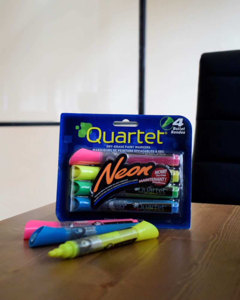 Lightboard pens set on a wooden table