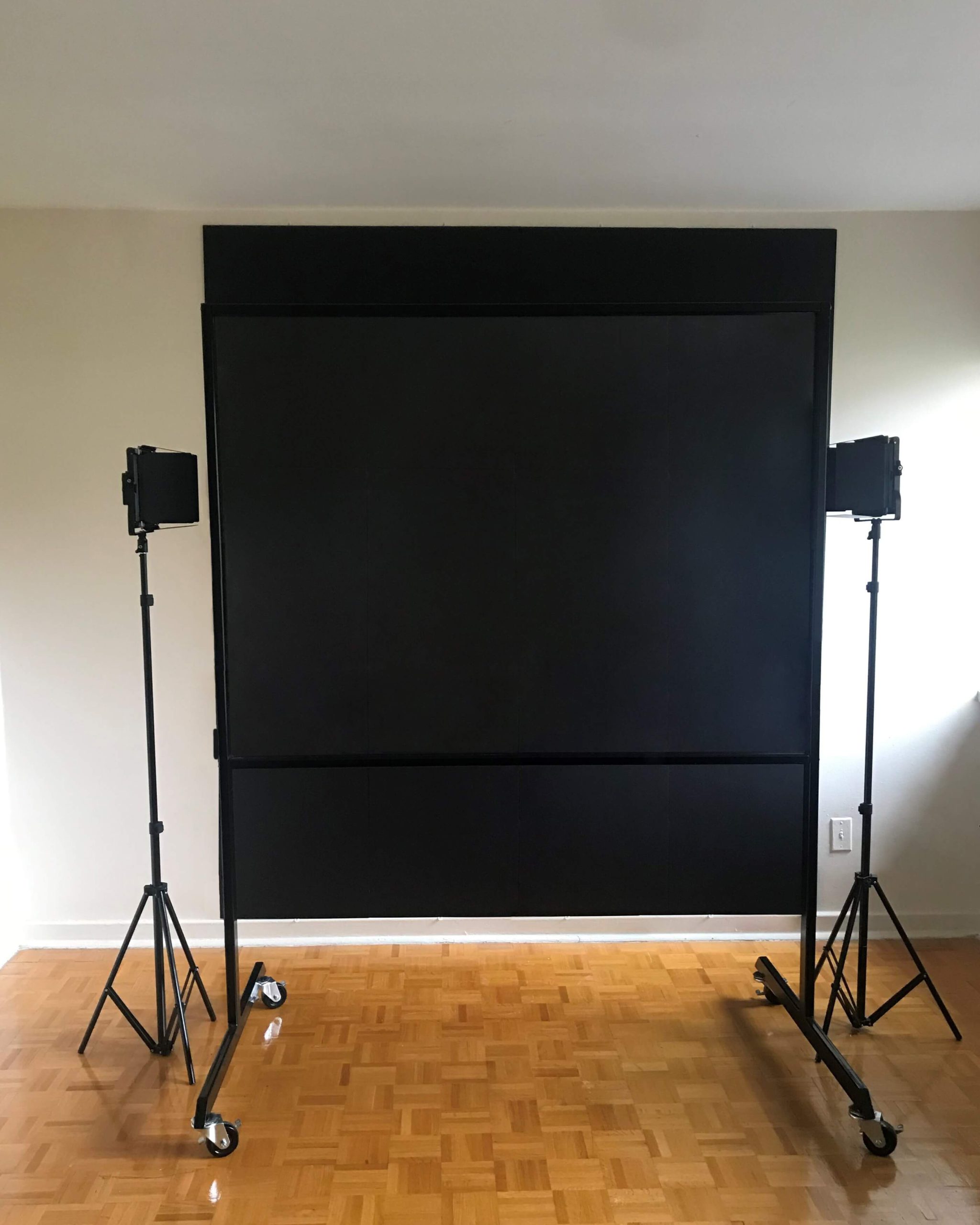 Lightboard studio package large showing lightboard classic product featured in front a black backdrop and two studio lights